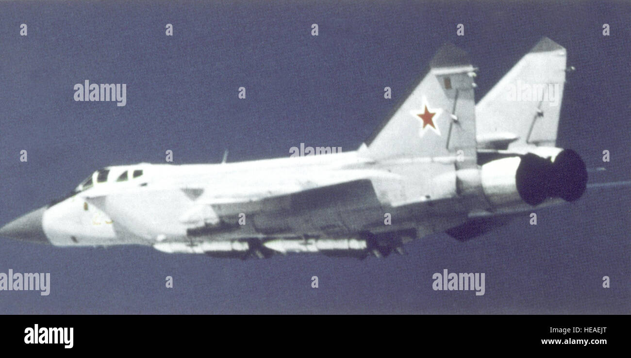 An air-to-air left side view of a Soviet MiG-31 Foxhound aircraft. Stock Photo