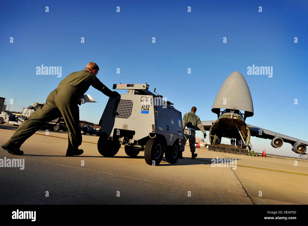 U.S. Air Force crew chiefs and maintainers load aerospace ground