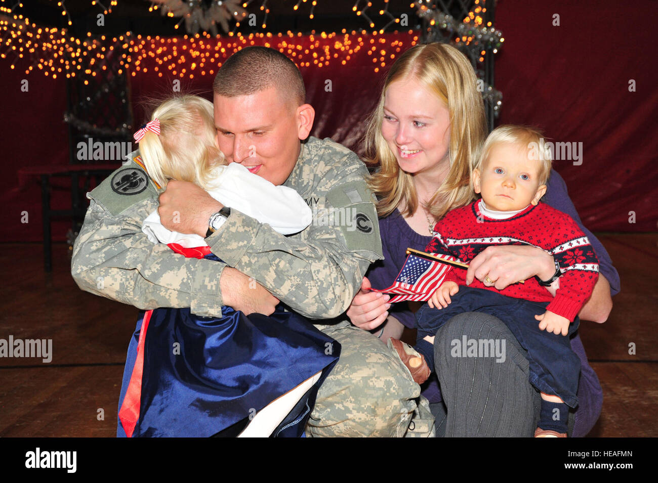 Colorado Army National Guard Sgt. Blake Olson greets his family at a small ceremony for the Soldiers of the 220th Military Police Company, Colorado Army National Guard, at the Fort Carson Events Center in Colorado Springs, Colo., Dec. 17. The Soldiers are returning from their deployment in support of Operation Iraqi Freedom. A few Soldiers are seeing their families for the first time since leaving for pre-deployment training last January. While deployed, the 220th MP Company was assigned to Task Force 134 at Camp Cropper in Baghdad, where Soldiers were responsible for detainee operations; ensu Stock Photo
