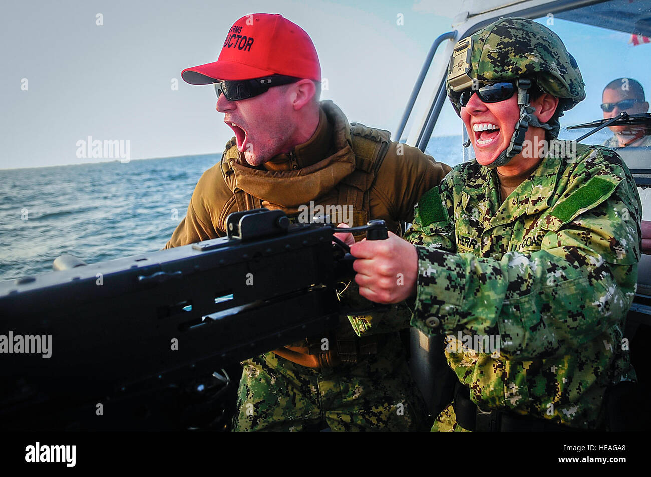 Petty Officer 1st Class Nicholas Sturges (left), gunner’s mate, and