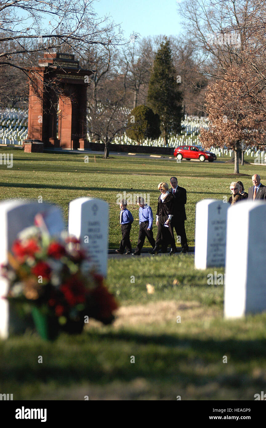 The family of Maj. Troy Gilbert walk to the grave site during a full