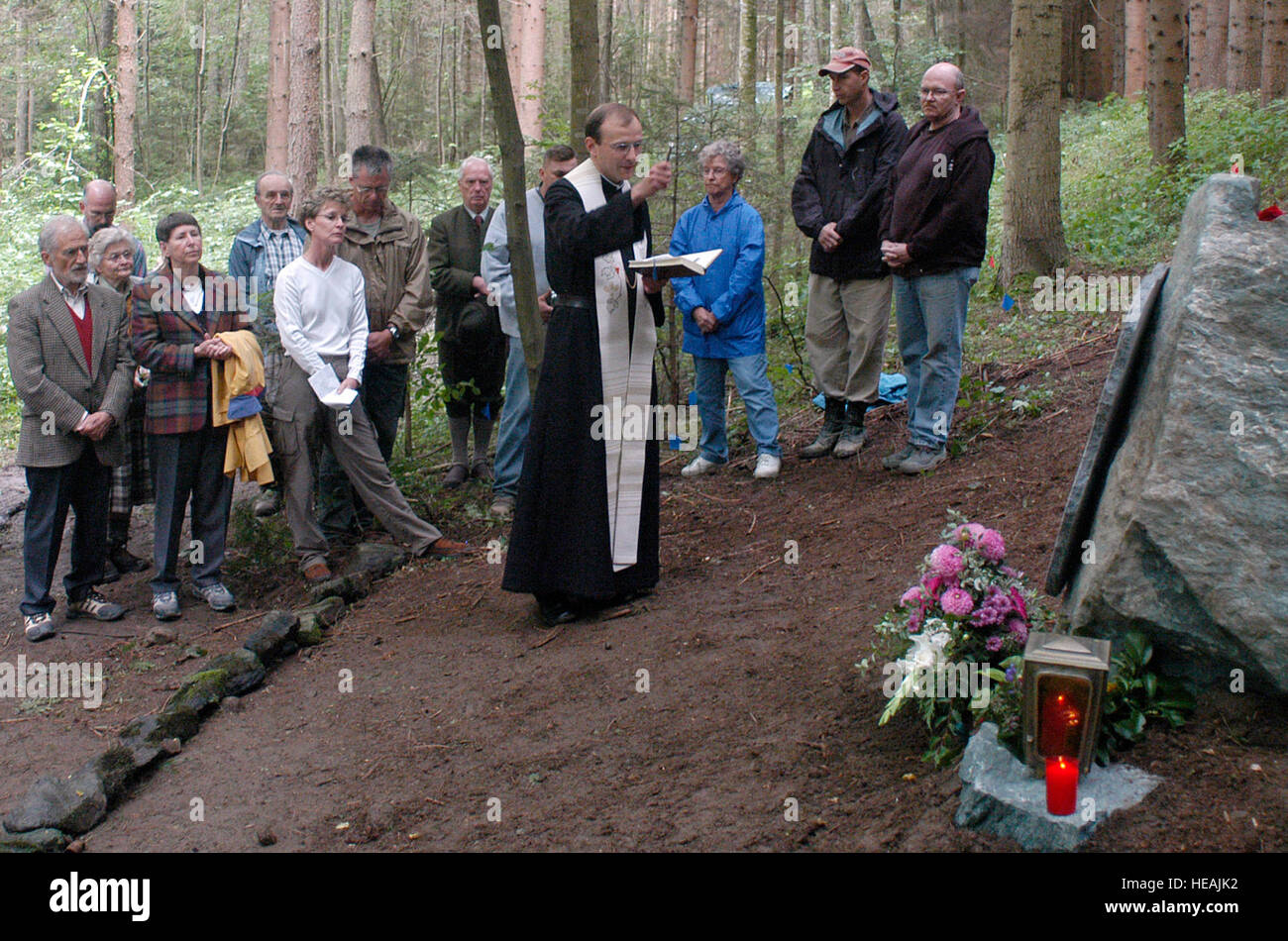 A priest from nearby Vostenhof, Austria, presides over an Aug. 27 memorial service for the members of a B-17 bomber that crashed in the area May 10, 1944. The service was attended by family, friends and members of the Joint POW/MIA Accounting Command. An 18-member JPAC team, including a forensic anthropologist, explosive ordnance disposal technician and field medic, from Hickam Air Force Base, Hawaii, returned Saturday after 45 days in Austria attempting to recover the remains of 1st Lt. Stanley Dwyer and gunner Sgt. John Boros who were lost in the crash. The mission of JPAC is to achieve the  Stock Photo
