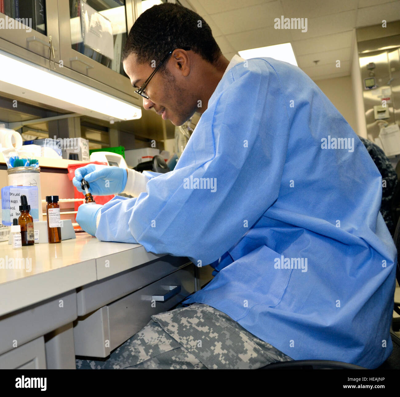 Army Spc. Aaron Madison performs biochemical testing to identify
