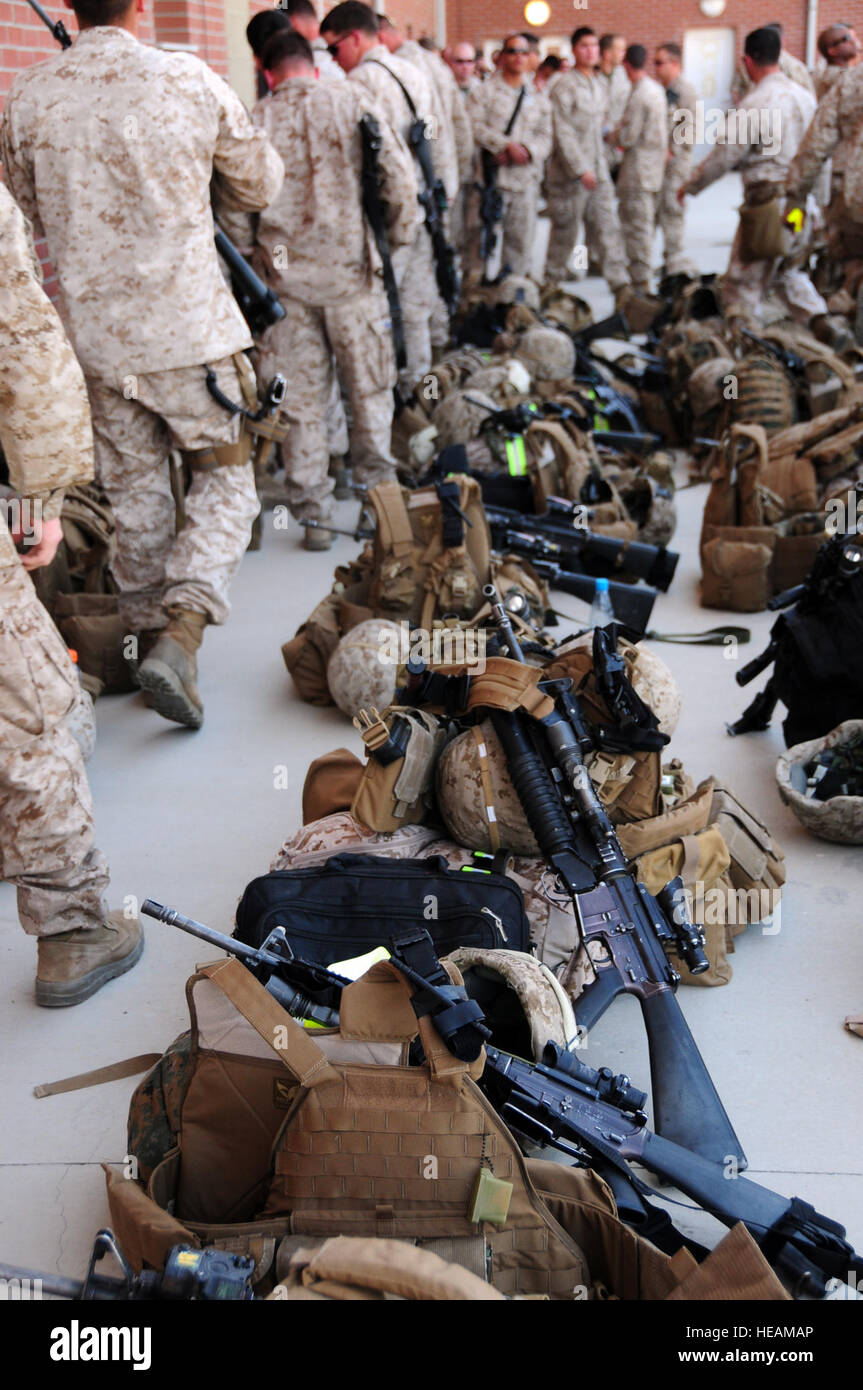 KABUL - More than 108 Marines from 2nd Battalion, 5th Marines, out of Camp Pendleton, Calif., remove their gear while taking a break at Kabul International Airport March 31, 2010. The Marines are beginning their 90-day deployment to Afghanistan in support of police development.  Staff Sgt. Sarah Brown/) Stock Photo