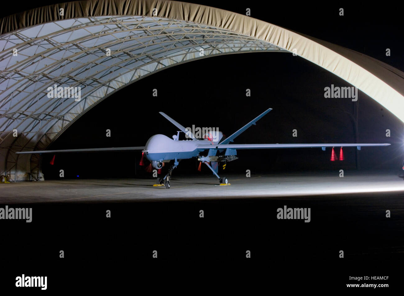 An armed MQ-9 Reaper unmanned aircraft sits in a shelter Oct. 15 at Joint Base Balad, Iraq, before a mission. Larger and more powerful than the MQ-1 Predator, the Reaper can carry up to 3,750 pounds of laser-guided bombs and Hellfire missiles. Tech. Sgt. Erik Gudmundson) Stock Photo