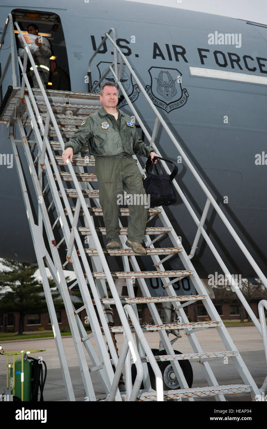 Col. Paul Murphy, 305th Air Mobility Wing commander originally from Boston, Mass., exits one of the 12 KC-10 Extenders after having piloted the aircraft during the ‘Elephant Walk’ exercise here, Dec. 20. An ‘Elephant Walk’ is a fundamental training element when preparing for global strike missions. The ‘Elephant Walk’ is a display of air power showcasing the 305th AMW’s contributions to Air Mobility Command. Members of the 32nd and 2nd Air Refueling Squadrons, as well as members from the 514th Air Mobility Wing, participated in the Employment Defense and Global Engagement exercise.  Russell Me Stock Photo