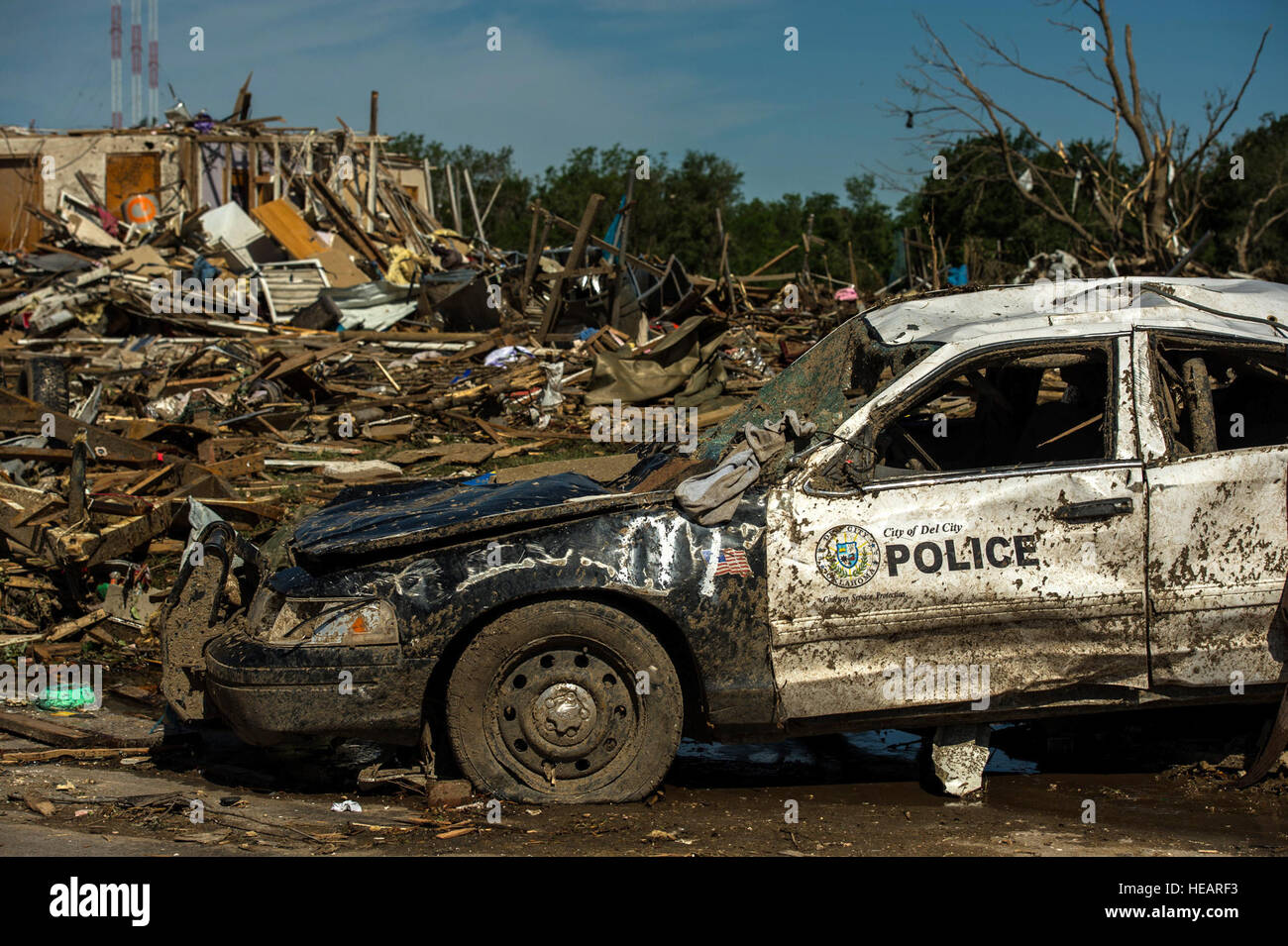 A police car was destroyed by a tornado May 22, 2013, in Moore, Okla. The EF-5 tornado, with winds reaching at least 200 mph, traveled for 20 miles, leaving a two-mile-wide path of destruction, leveling homes, crushing vehicles, and killing more than 20 people. More than 115 Oklahoma National Guard have been activated to assist in the rescue and relief efforts.  Staff Sgt. Jonathan Snyder/ Released) Stock Photo