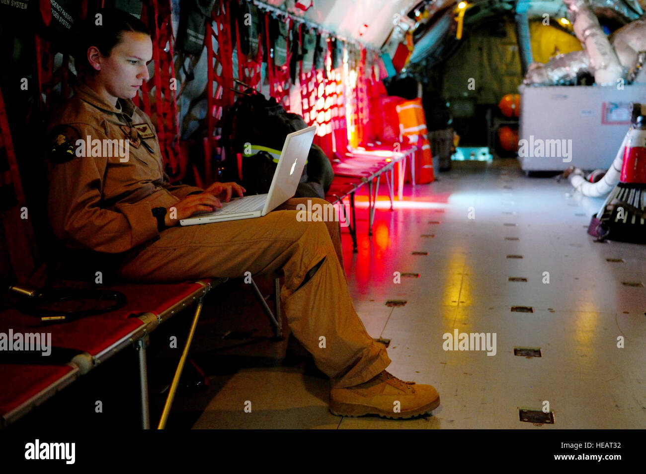 Staff Sgt. Amanda Helton, 1st Combat Camera Squadron aerial combat videographer, edits video footage aboard a KC-135 Stratotanker, assigned to the 340th Expeditionary Air Refueling Squadron, during a refueling mission supporting Operation Enduring Freedom in the skies above Afghanistan, Feb. 25, 2011. Master Sgt. William Greer) Stock Photo