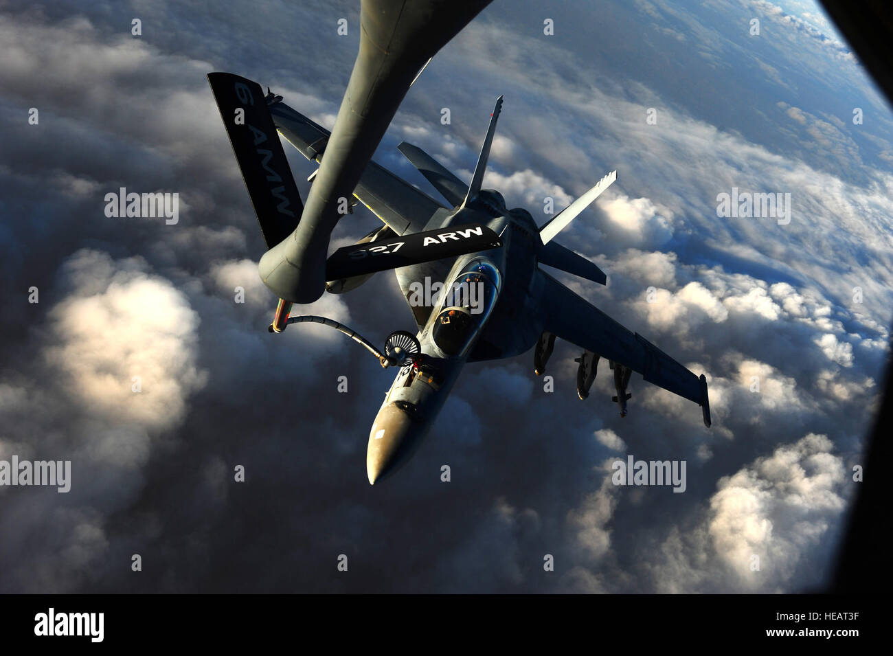 A Navy F/A-18 Super Hornet, assigned to the USS Carl Vinson, receives fuel from a KC-135 Stratotanker assigned to the 340th Expeditionary Air Refueling Squadron in the skies above Afghanistan in support of Operation Enduring Freedom, Mar. 2, 2011. Master Sgt. William Greer) Stock Photo