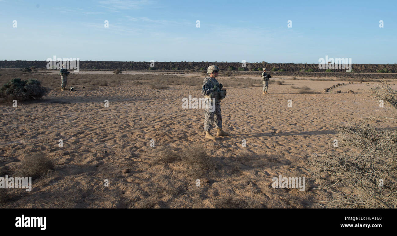 Soldiers from Alpha Company,1st Armored Battalion, 77th Armored Regiment 3rd Armored Brigade Combat Team, 1st Armored Division, East Africa Response Force (EARF) wait to begin a live fire training exercise at the Arta training range in Djibouti, May 30, 2015. The EARF is a quick reaction force designed to defend U.S. assets within the Combined Joint Task Force Horn of Africa area of responsibility. This photo has been cropped to emphasize the subject. ( Staff Sgt. Gregory Brook/ Released) Stock Photo