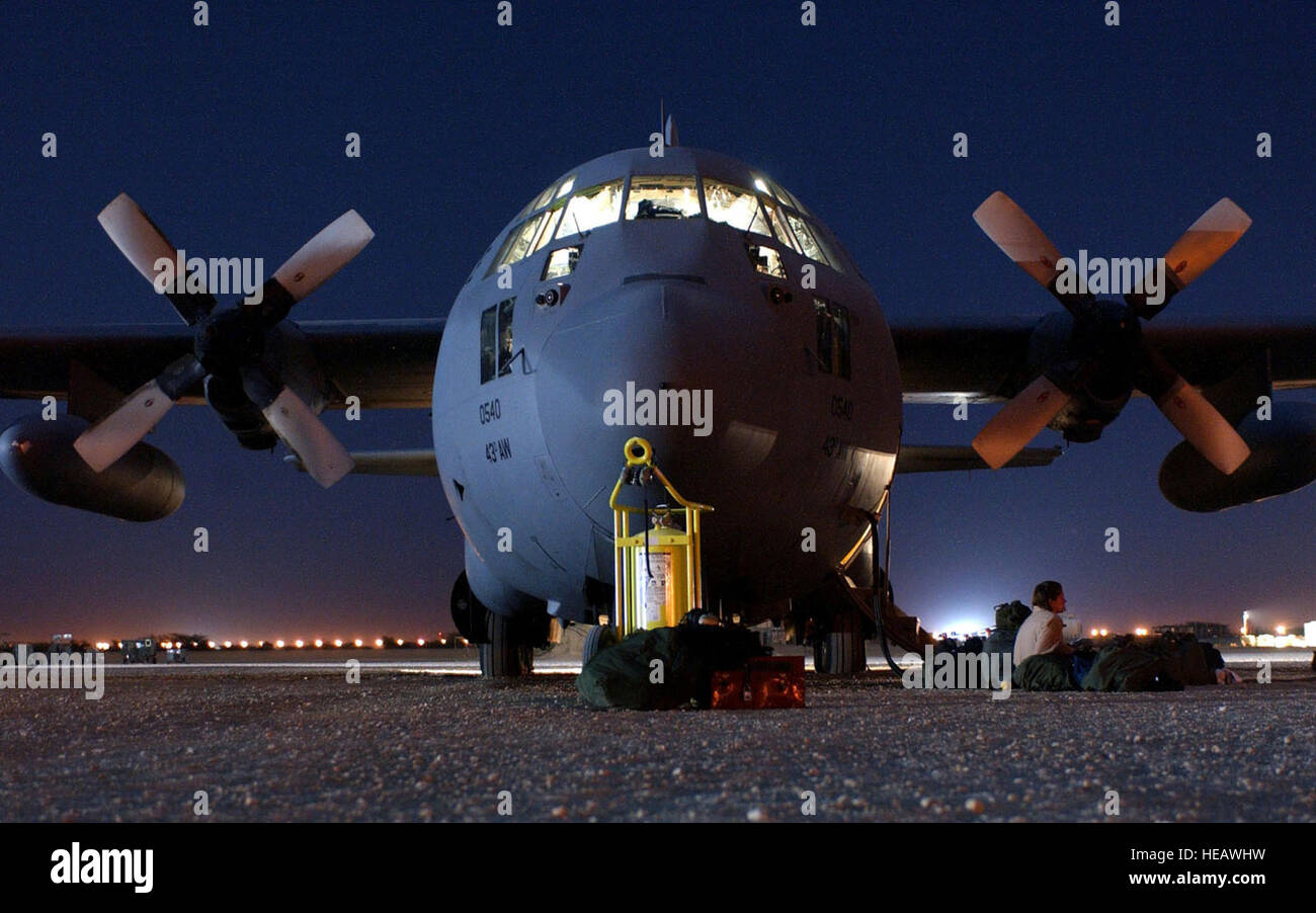 OPERATION ENDURING FREEDOM -- A C-130 Hercules, assigned to the 320th Air Expeditionary Wing at a forward-deployed location, awaits its next mission on the flightline.  The aircraft was used to perform a heavy equipment airdrop into south central Afghanistan supporting Operation Enduring Freedom.   Staff Sgt. Cherie Thurlby) Stock Photo