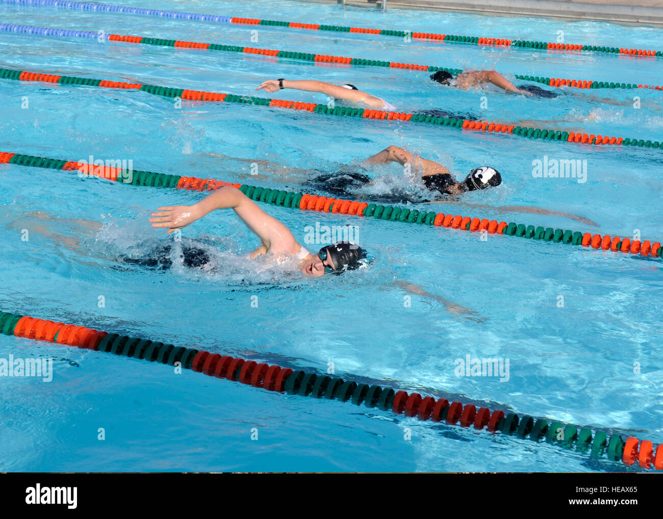 Participants complete the first leg of a minitriathlon, a 500 meter