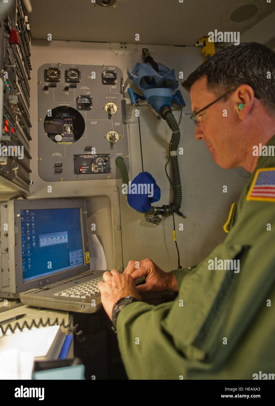 A U.S. Air Force Reserve master sergeant inputs flight data aboard a C ...