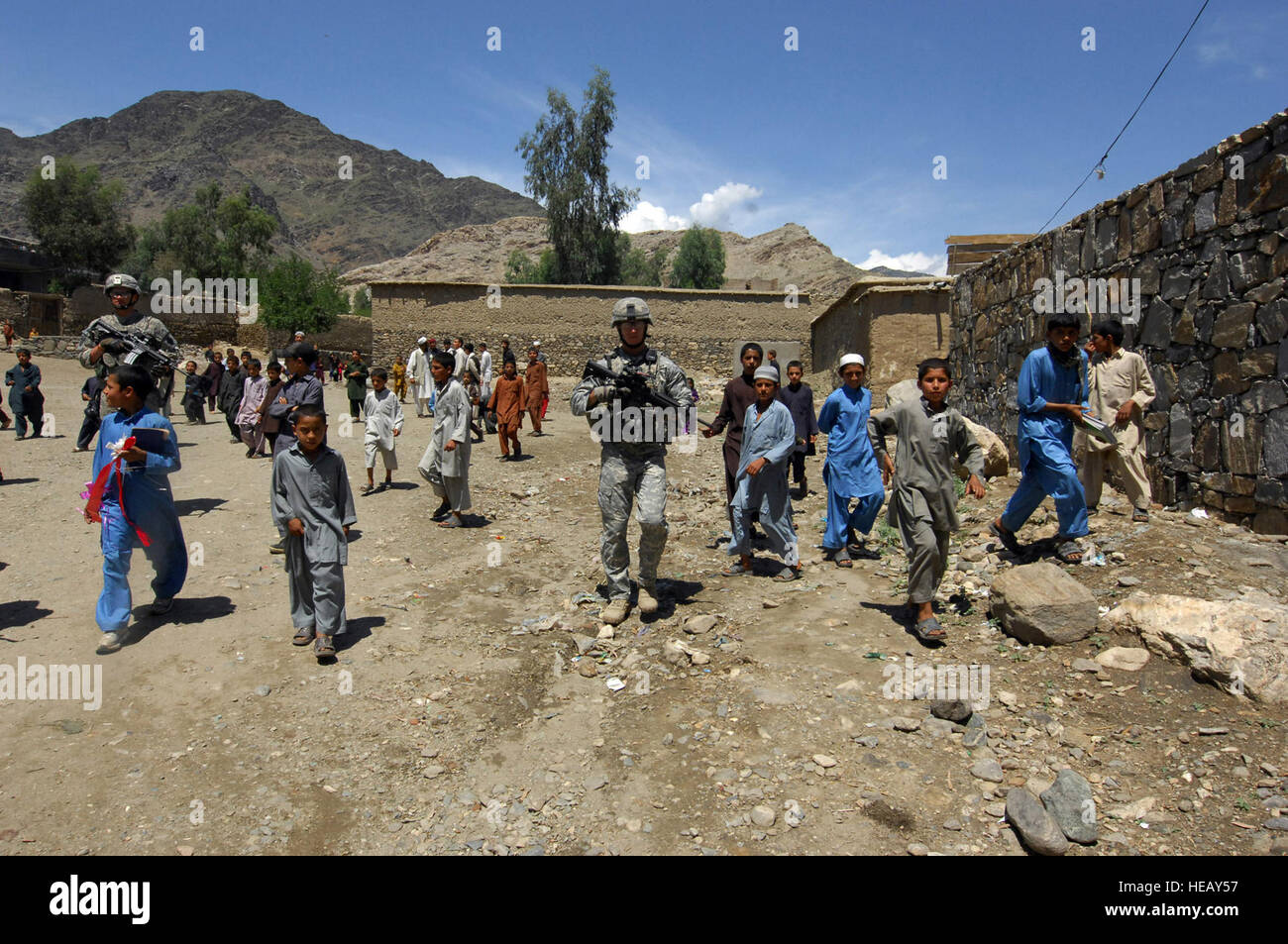 KUNAR PROVINCE, Afghanistan – Children in Dam Kalay village, outside of Asadabad in eastern Afghanistan&#39;s Kunar province, chase behind members of the Kunar Provincial Reconstruction Team, April 27. The PRT attended