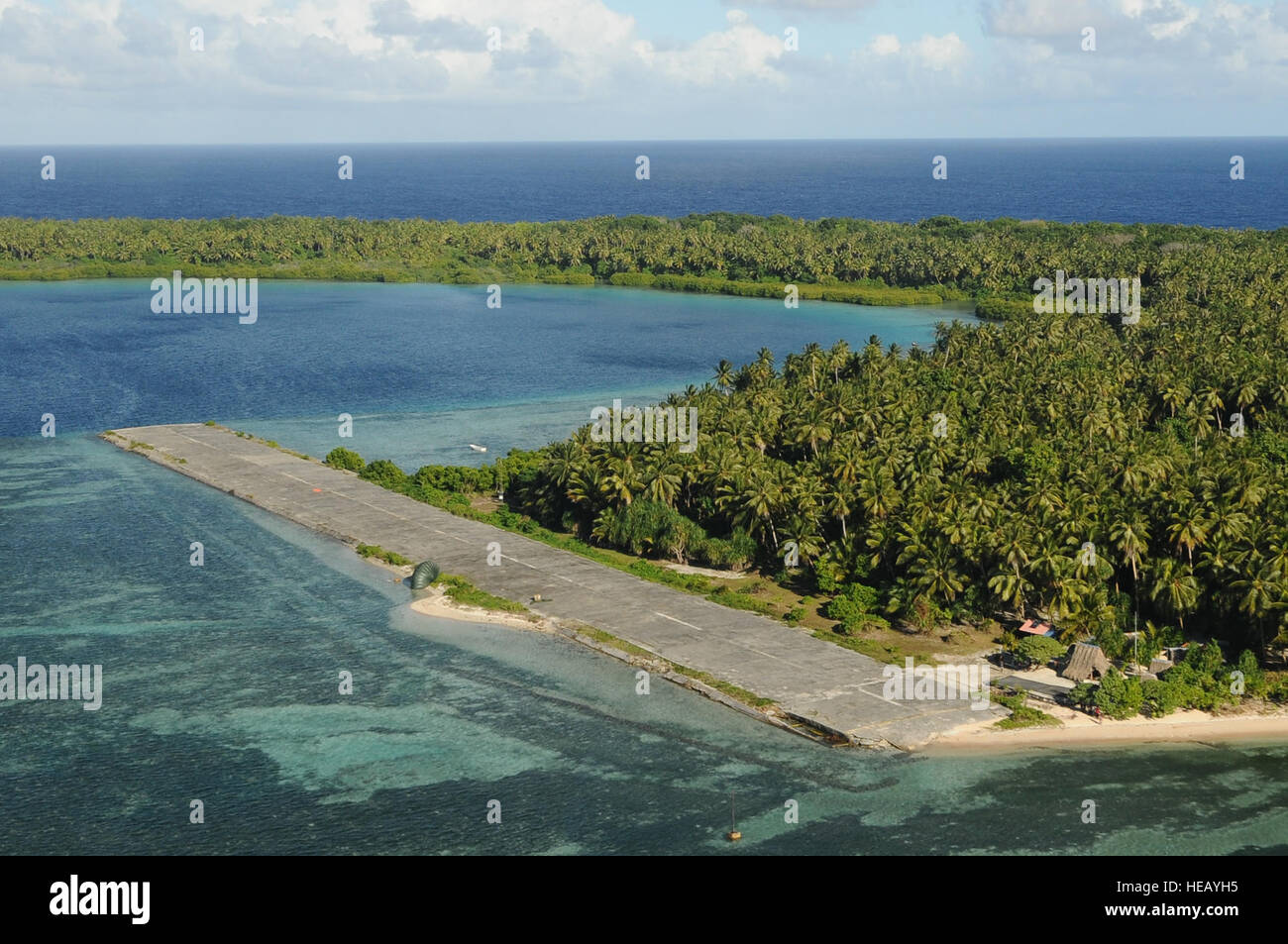 Two packages land on the runway at Pingelap Island, part of Pohnpei