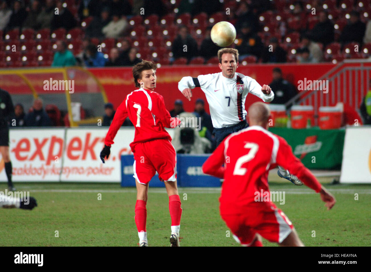 American soccer player Eddie Lewis directs the ball forward with a 'header' during the U.S. Men's National Soccer Team 1-0 victory over Poland, Wednesday, March 1, 2006, in Kaiserslautern, Germany.  More than 13,000 soccer fans attended the exhibition match at Fritz-Walter-Stadium. Master Sgt. John E. Lasky) Stock Photo