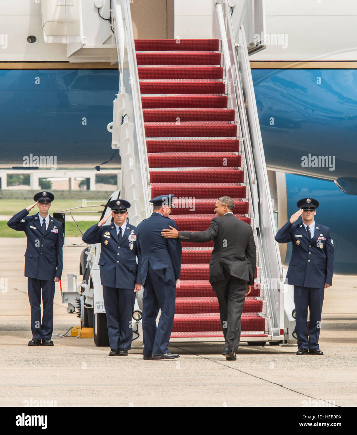President Barrack Obama bids farewell to Col. J.C. Millard, 89th Airlift Wing commander, as 89th AW Airmen salute the Commander-in-Chief at Joint Base Andrews, Md., July 15, 2015. Obama departed Andrews aboard an 89th AW C-32A.  Senior Master Sgt. Kevin Wallace/) Stock Photo