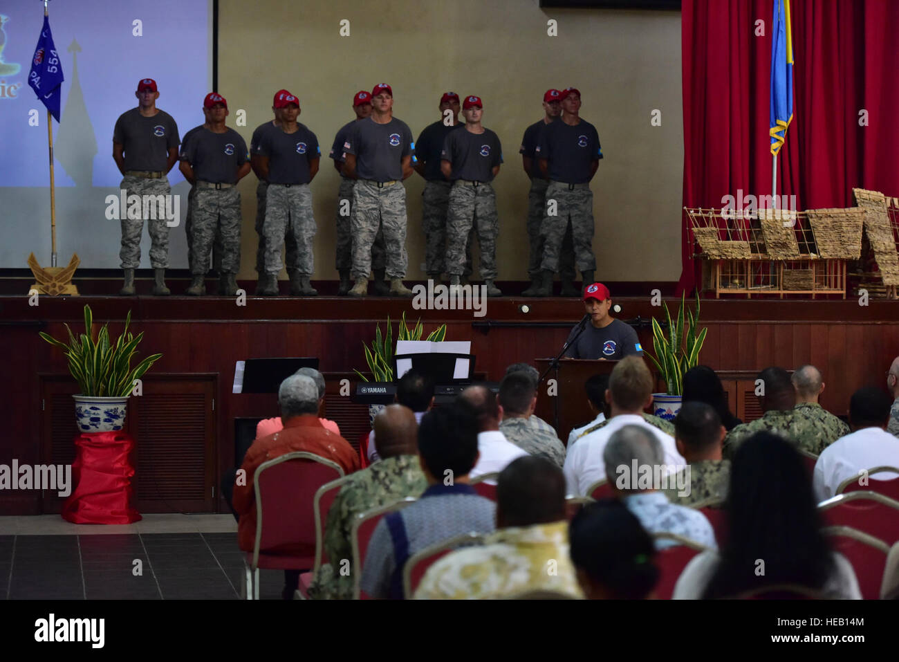 United States Air Force Capt. Naseem Ghandour, Civil Action Team 554-01 officer in charge and engineering flight deputy commander from the 554th RED HORSE Squadron from Andersen Air Force Base, Guam, speaks during a change of charge ceremony, held Feb. 19, 2016, at the Ngarachamayong Cultural Center, located in Palau’s Koror state. Airmen of CAT 554-01 provided construction capabilities, apprenticeship training, medical outreach and community engagement opportunities while deployed to the Republic of Palau.  Staff Sgt. Christopher Stoltz Stock Photo