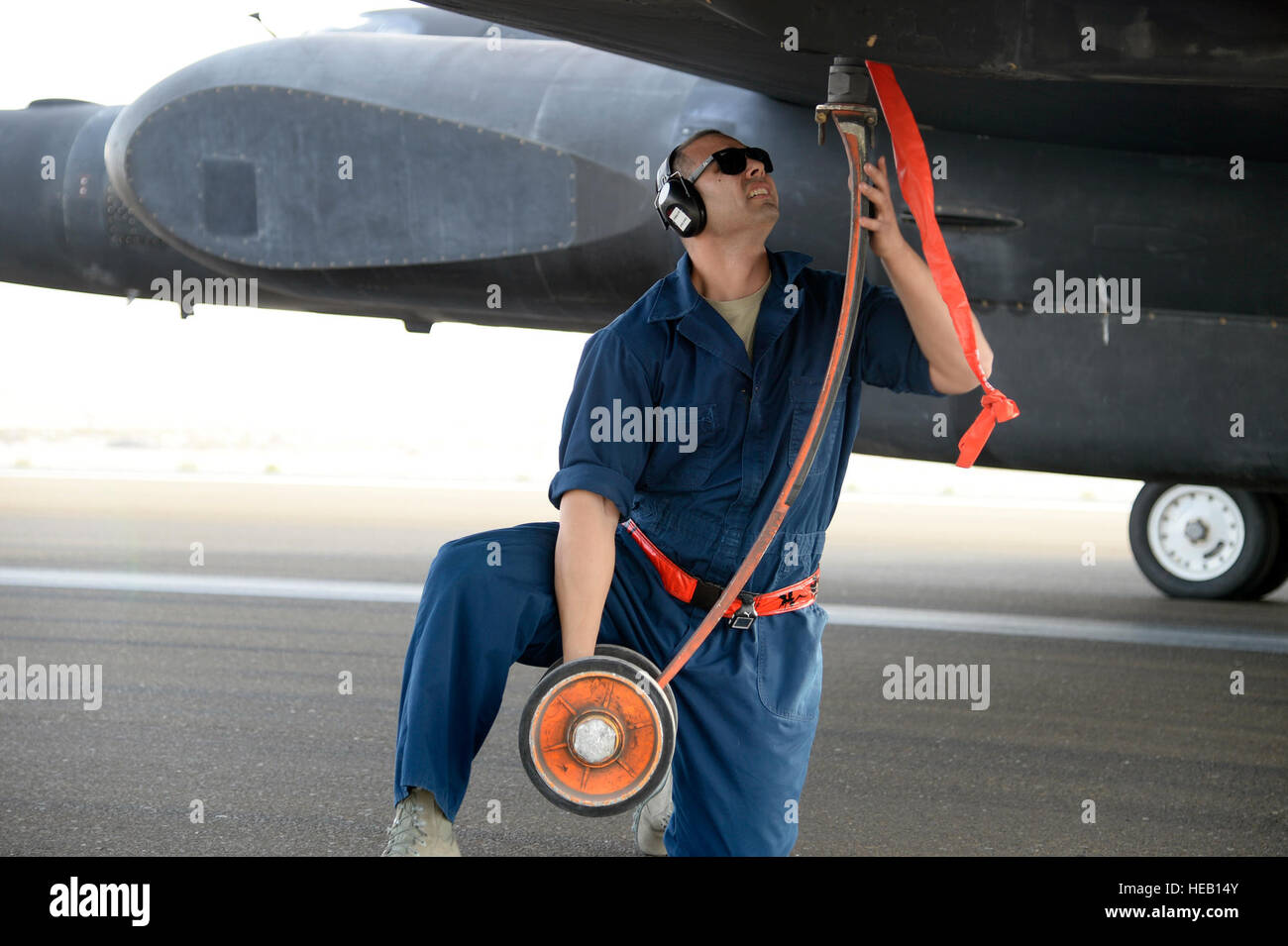 Staff Sgt. Ruben, Dragon Aircraft Maintenance Unit, installs a pogo