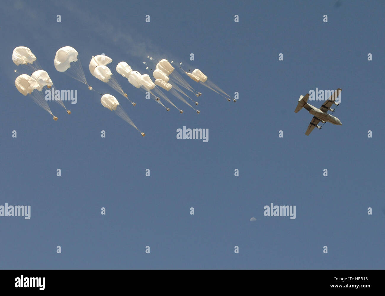 An Italian Air Force C-130 Hercules airdrops pallets of water and fuel  during a re-supply of Forward Operating Base Ice, Gulistan District, Farah  Province, Afghanistan, July 22. (ISAF photo/ USAF 1st Lt