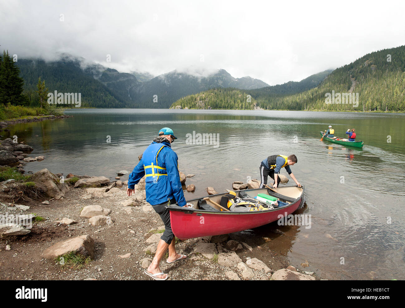 A group of canoe campers push off for a trip across Callaghan Lake