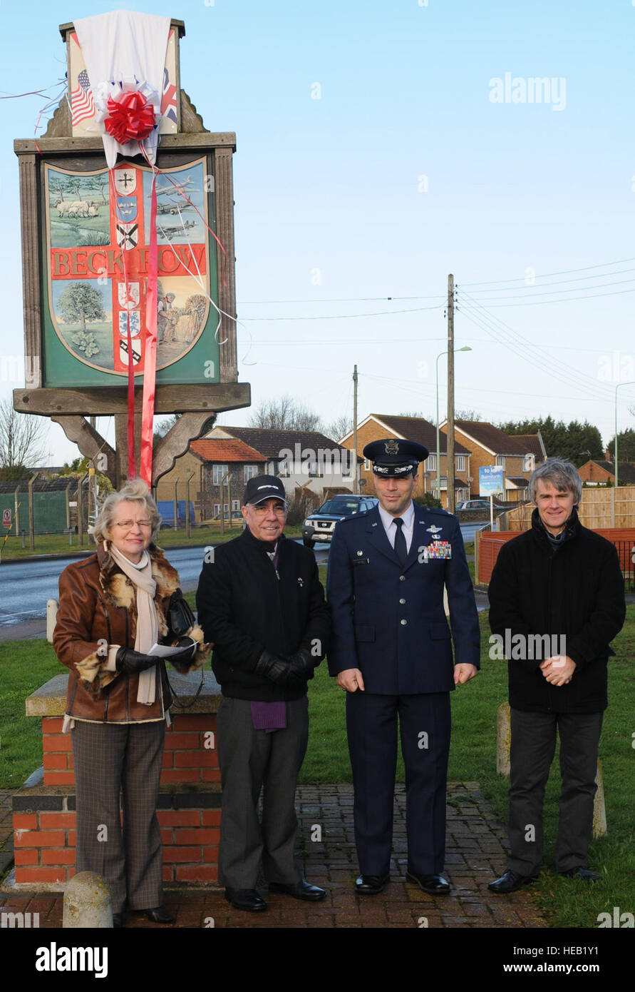 From left, Kay Sallis, chairman of Beck Row, Holywell Row and Kenny Hill Parish Council, Ken Thompson, British-American Committee chairman, Col. Christopher Kulas, 100th Air Refueling Wing commander, and Gary Rogers, 100th ARW Public Affairs graphic artist, unveil the new Beck Row sign Feb. 2, 2013, at Beck Row, England. The new sign symbolizes the unity between RAF Mildenhall and the local community.   Master Sgt. Latisha Cole Stock Photo