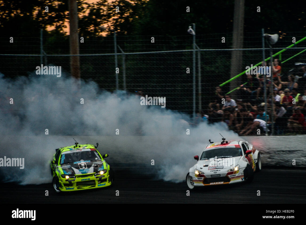 Air Forcesponsored Formula Drift driver Ryan Tuerck (left) drifts his