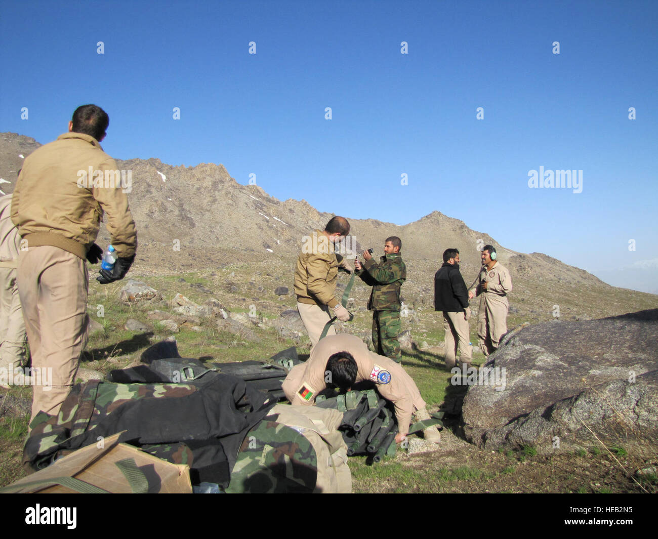 SALANG PASS, Afghanistan –Afghan National Army Air Corps medics prepare litters and other supplies at the landing zone about 1,000 feet below where the Pamir Airlines passenger crashed.  There were no survivors among the 38 passengers and 5 crew.  Tech. Sgt. Mike Tateishi/) Stock Photo