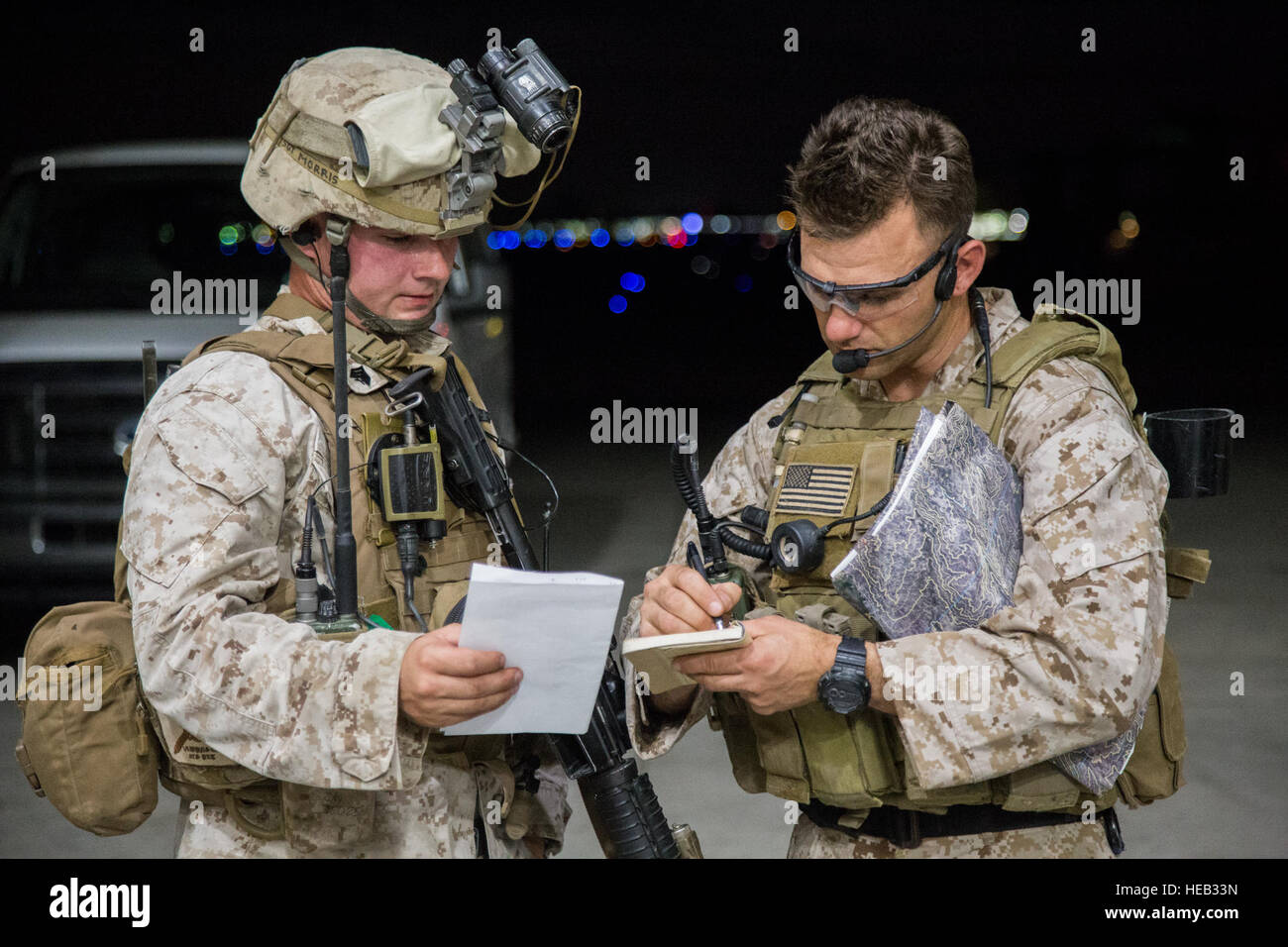 Marines discuss their scheme of maneuver before a tactical recovery of