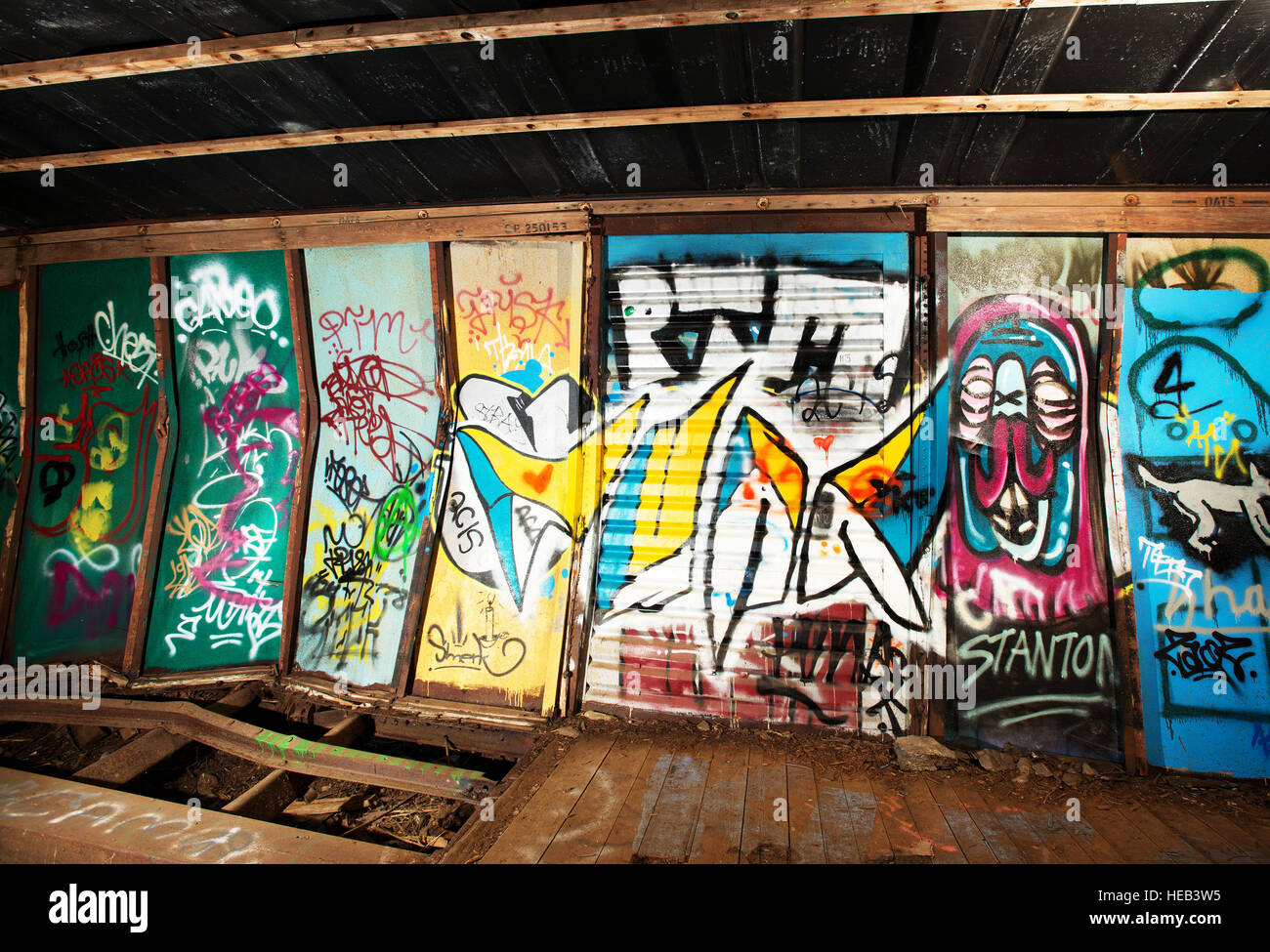 The Train Wreck trail.  The wrecked box cars left over from a 1950's PGE railway derailment, now a popular spot for local graffiti artists. Stock Photo