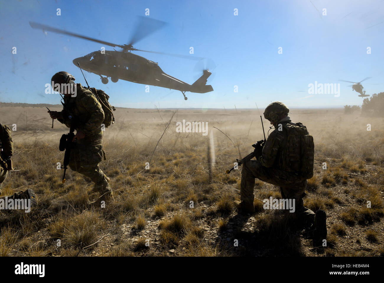 50th Loading 3rd Space Operations Squadron personnel load a UH-60 Blackhawk ...