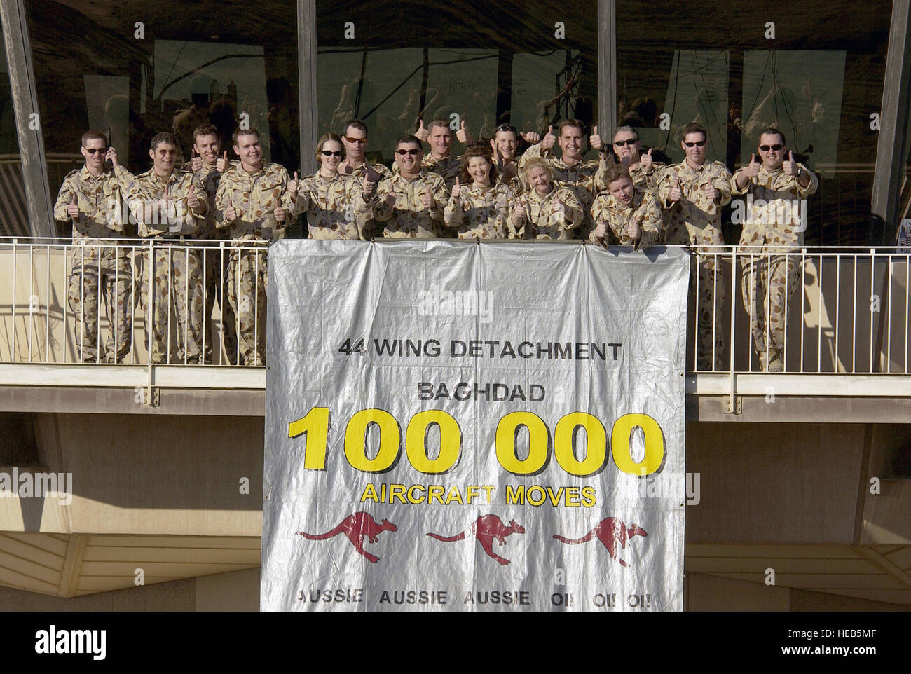 Austrailian military personnel from the Australian Air Control Tower Detachmet, Task Unit 633.4.2 celebrate the One Hundred Thousand aircraft to move through Baghdad International Airport (BIA), Iraq, in support of Operation IRAQI FREEDOM. Stock Photo