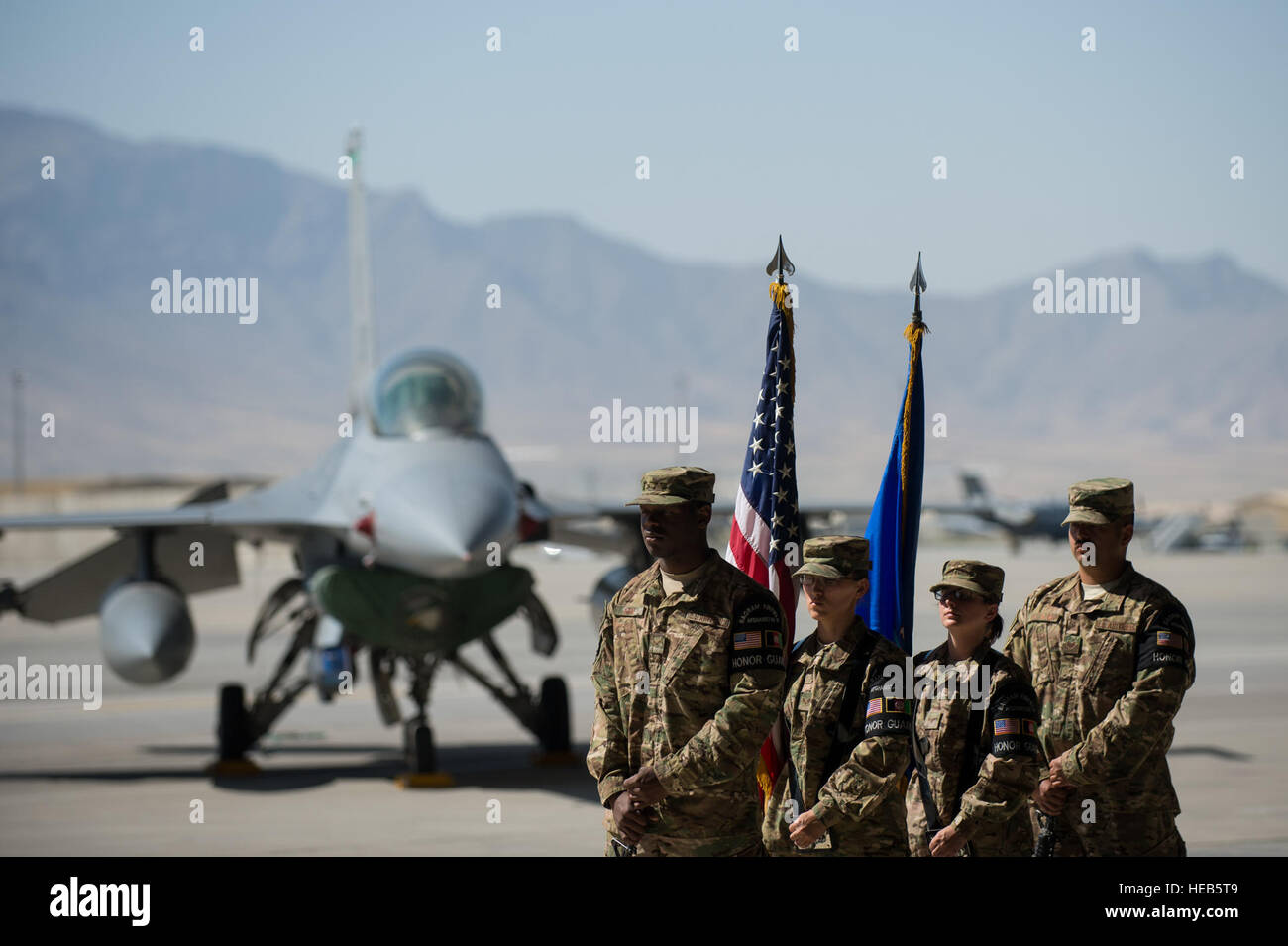 U.S. Airmen with the Bagram Air Field Honor Guard stand ready to present the colors during the 455th Air Expeditionary Wing change of command ceremony at Bagram Air Field, Afghanistan, July 1, 2015. During the ceremony Kelly relinquished command of the 455th AEW to Brig. Gen. Dave Julazadeh.   Tech. Sgt. Joseph Swafford Stock Photo