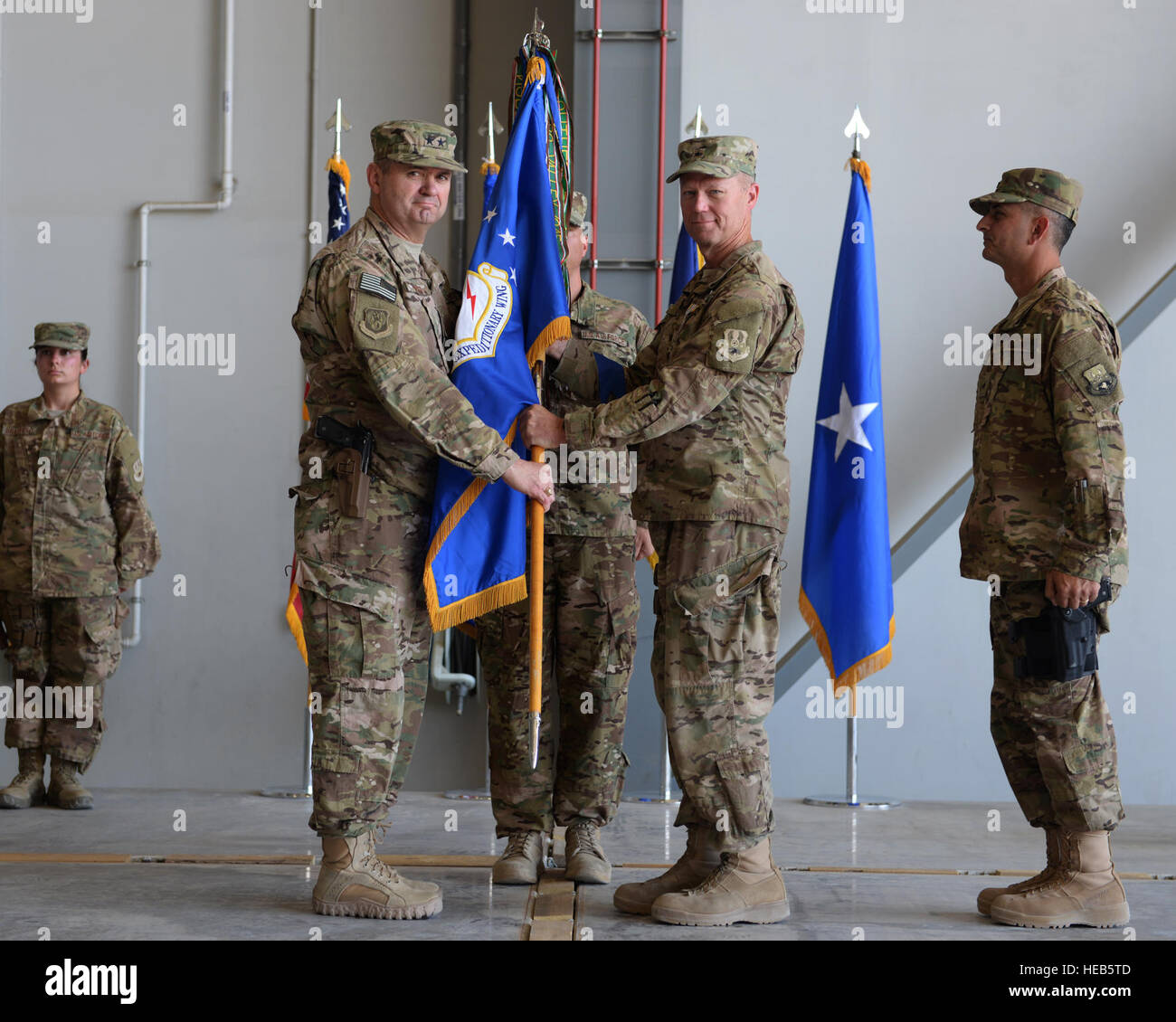 U.S. Air Force Maj. Gen. Scott West, 9th Air and Space Expeditionary Task Force-Afghanistan commander, relieves Brig. Gen. Mark Kelly from command during a change of command ceremony July 1, 2015, at Bagram Air Field, Afghanistan. Kelly relinquished command to the new commander Brig. Gen. Dave Julazadeh.  Senior Airman Cierra Presentado Stock Photo