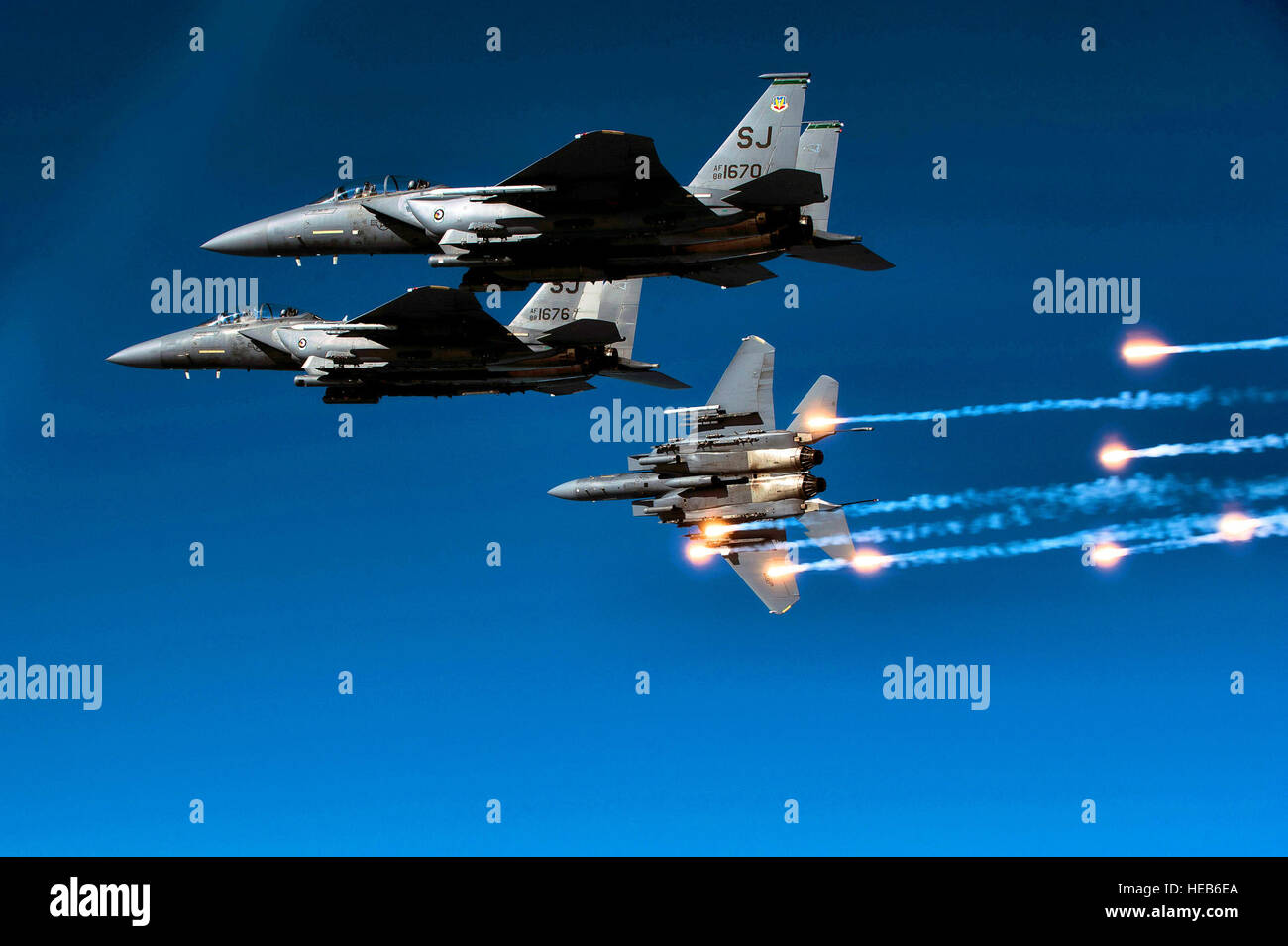 A U.S. Air Force F-15E Strike Eagle aircraft from the 335th Fighter Squadron releases flares during a local training mission over North Carolina, Dec. 17, 2010.   Staff Sgt. Michael B. Keller) Stock Photo
