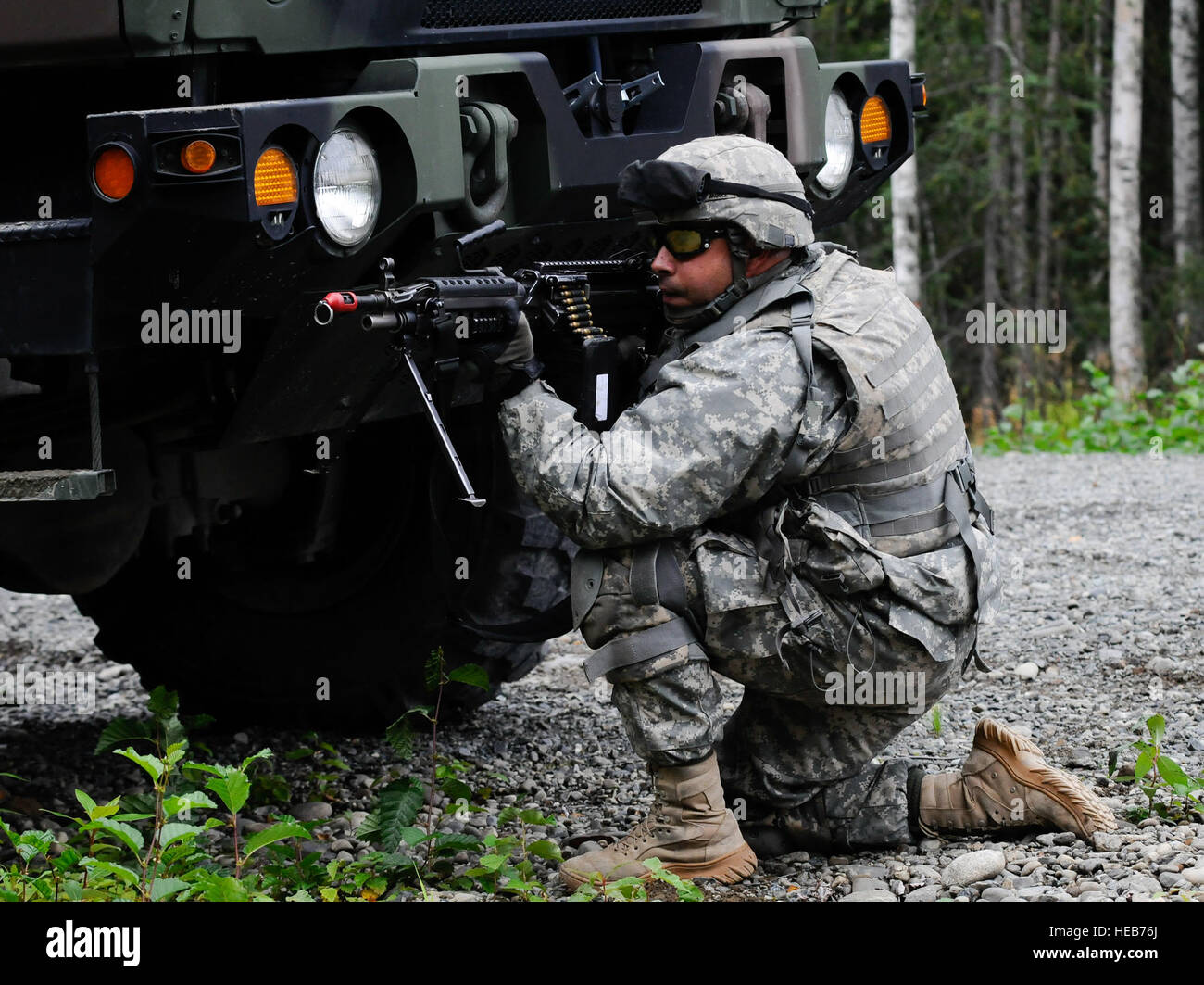 Soldiers of the 56th Engineer Company (Vertical), 6th Engineer Battalion, hone their skills during tactical convoy operations training at JBER-Richardson, Aug 23.  Improvised explosive devices, rocket-propelled grenades, and small arms pose a constant threat to military convoys.  As such, commanders at all echelons work to ensure their units are trained in the most effective tactics and techniques to counter these threats and reduce risks to during tactical convoys. Stock Photo