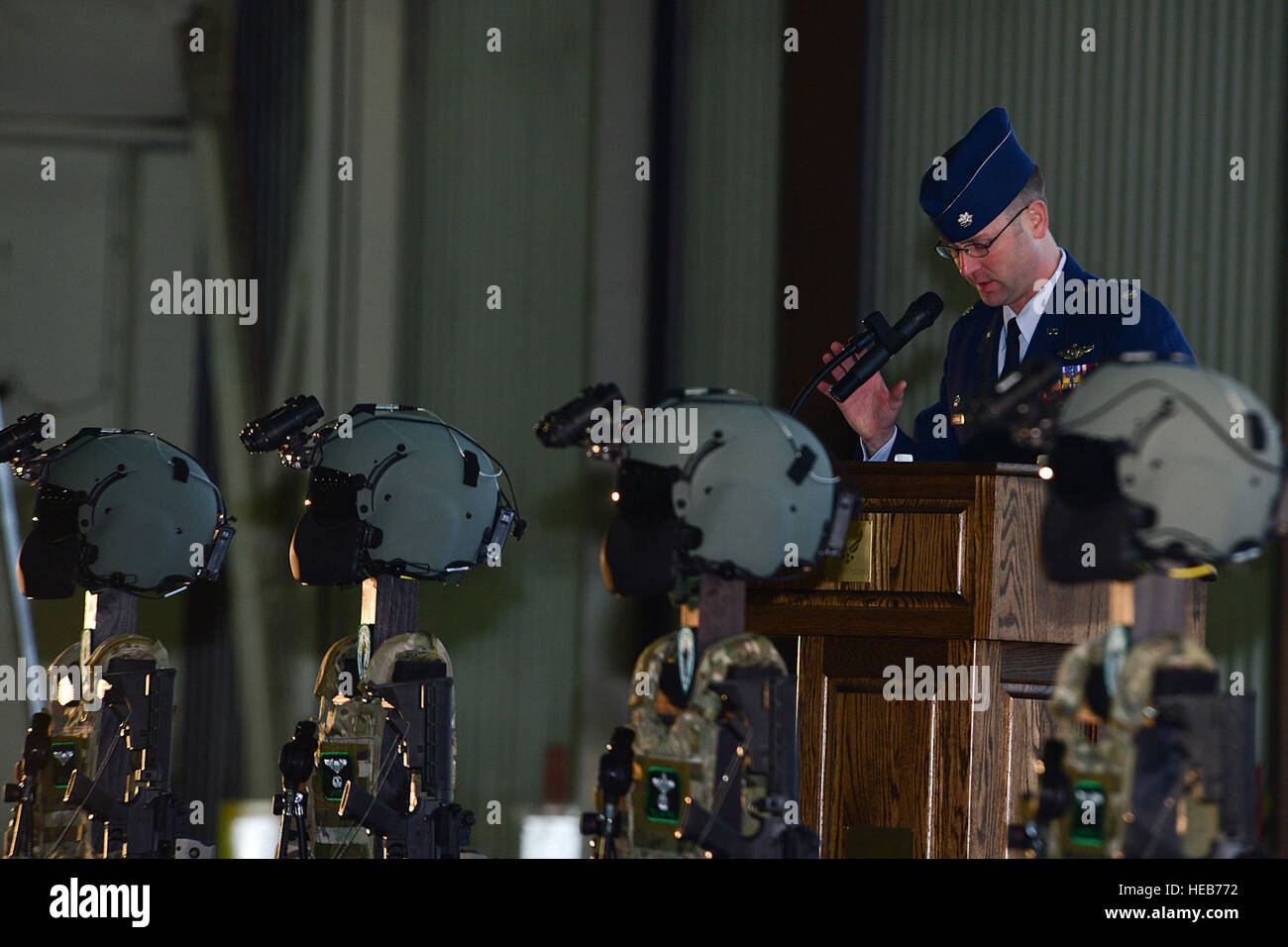 Lt. Col. Jared Herbert, 56th Rescue Squadron commander, gives personal accounts of four fallen airmen from the 56th RQS during a memorial service Jan. 17, 2014. The memorial service was held to honor Capt. Sean Ruane, Capt. Christopher Stover, Tech. Sgt. Dale Mathews and Staff Sgt. Afton Ponce, who were killed during an HH-60G Pave Hawk helicopter crash while performing a low-level training mission on the Norfolk coast Jan. 7, 2014.  Airman 1st Class Dana J. Butler Stock Photo