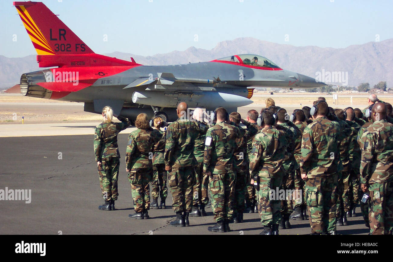 Members of the 944th Fighter Wing salute as a 302nd Fighter Squadron ...