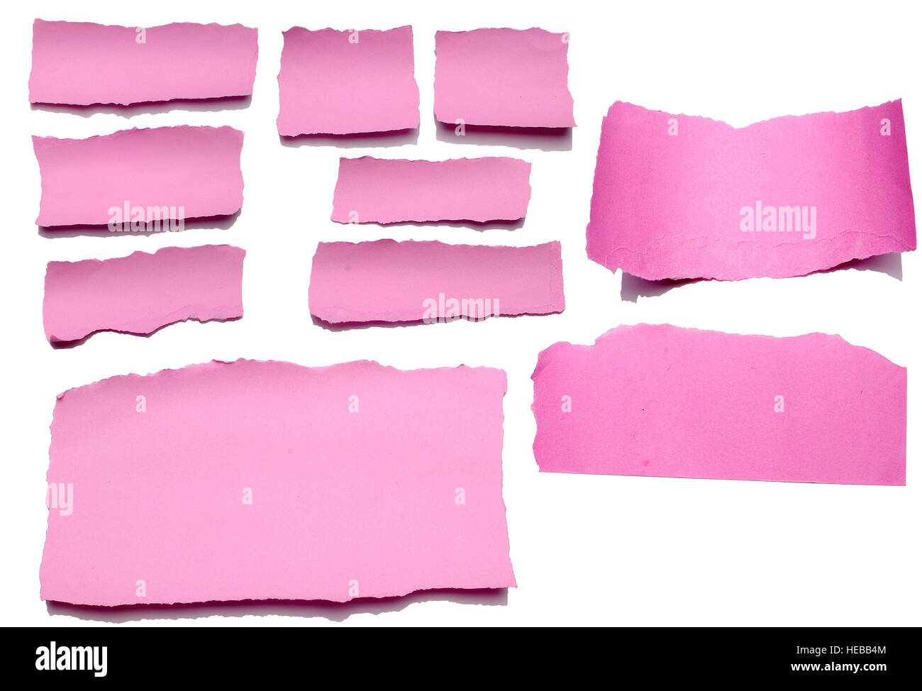 Collection of pink paper tears, isolated on white with soft shadows. Stock Photo