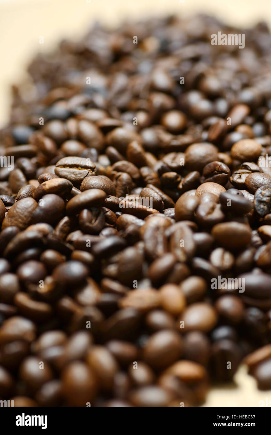 Brown roasted coffee beans isolated on white background Stock Photo - Alamy