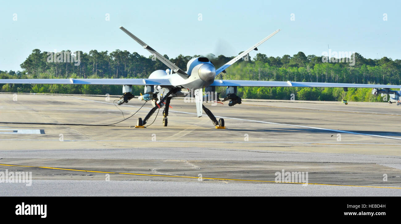 An MQ-9 prepares to take off on the flight line at Hurlburt Field Fla., May 3, 2014.The MQ-9 Reaper is an armed, multi-mission, medium-altitude, long-endurance remotely piloted aircraft that is employed primarily as an intelligence-collection asset and secondarily against dynamic execution targets.(U.S. Air Force photo/Staff Sgt. John Bainter) Stock Photo