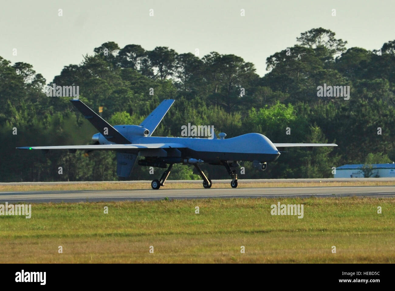 An MQ-9 Reaper prepares to take off at Hurlburt Field Fla., May 3, 2014.The MQ-9 Reaper is an armed, multi-mission, medium-altitude, long-endurance remotely piloted aircraft that is employed primarily as an intelligence-collection asset and secondarily against dynamic execution targets.(U.S. Air Force photo/Staff Sgt. John Bainter) Stock Photo