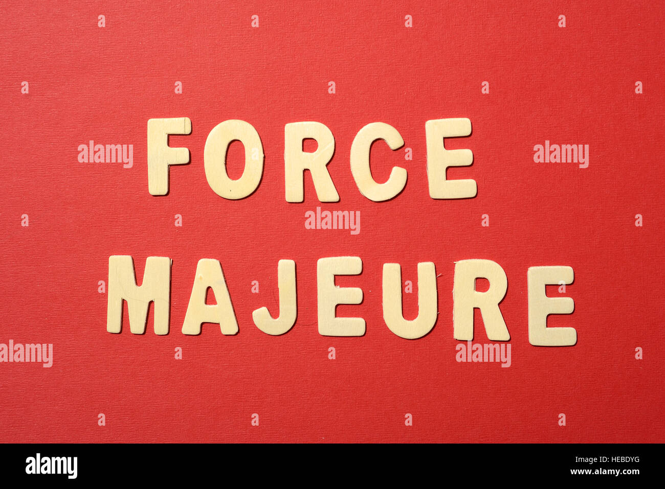 Force majeure text on red paper backbround Stock Photo Alamy