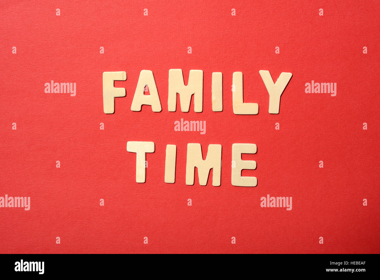 Family time text on red paper background Stock Photo - Alamy