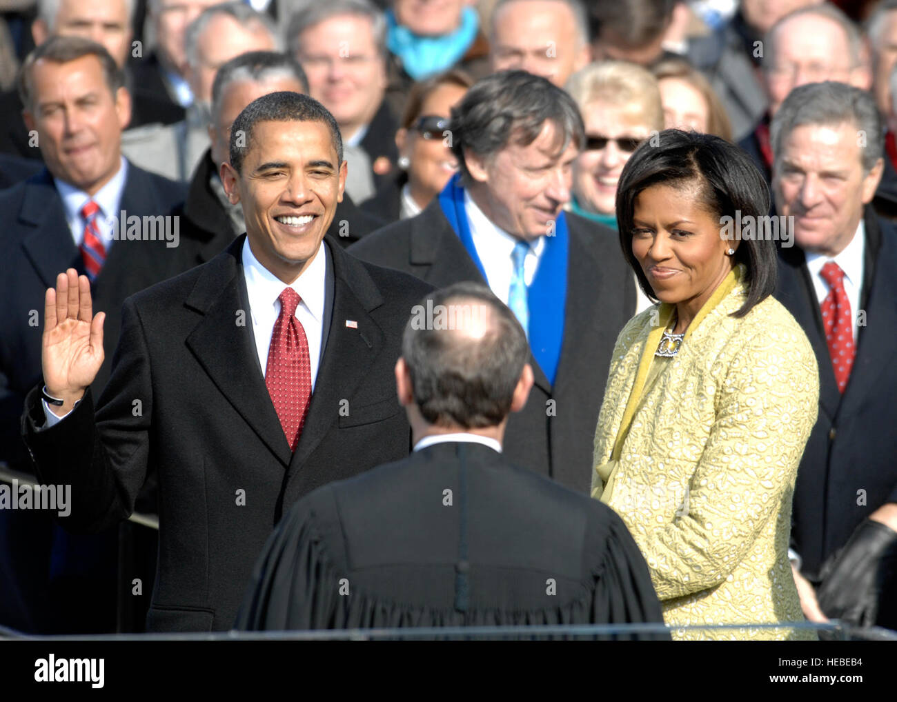 With his family by his side, Barack Obama is sworn in as the 44th president of the United States by Chief Justice of the United States John G. Roberts Jr. in Washington, D.C., Jan. 20, 2009.  More than 5,000 men and women in uniform are providing military ceremonial support to the presidential inauguration, a tradition dating back to George Washington's 1789 inauguration.  (DoD photo by Master Sgt. Cecilio Ricardo, U.S. Air Force/Released) Stock Photo