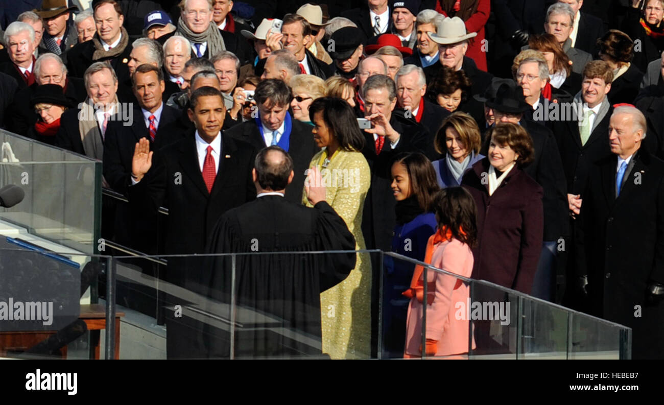 Barack Hussein Obama takes the oath of office from U.S. Chief Justice John G. Roberts Jr. in Washington, D.C., Jan. 20, 2009, becoming the 44th president of the United States.  More than 5,000 men and women in uniform are providing military ceremonial support to the presidential inauguration, a tradition dating back to George Washington's 1789 inauguration.  (DoD photo by Master Sgt. Cecilio Ricardo, U.S. Air Force/Released) Stock Photo
