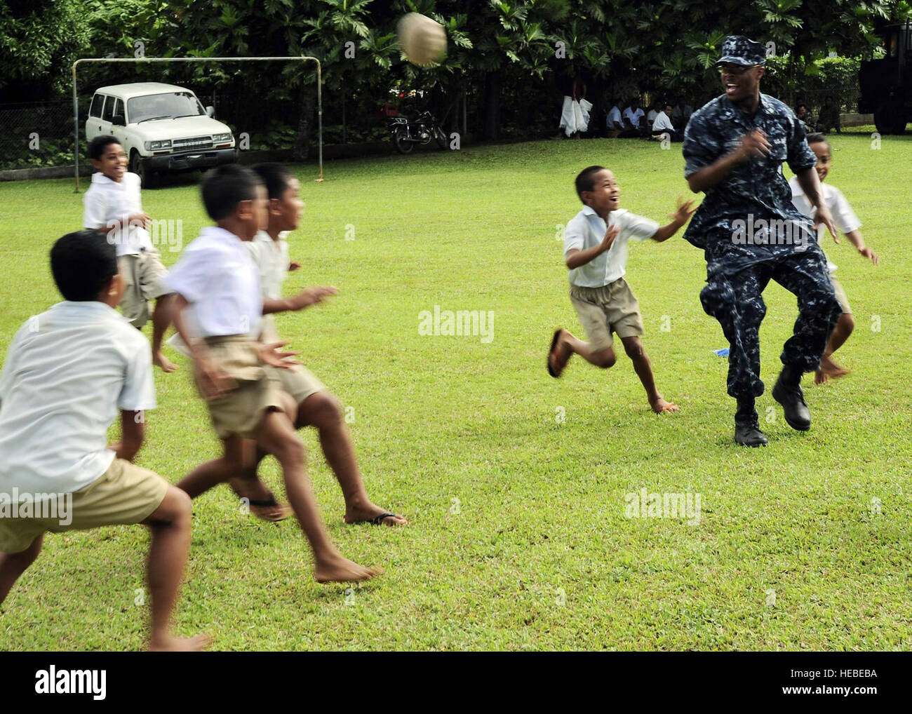 Petty Officer 3rd Class Dwight Moffitt, musician, plays rugby with