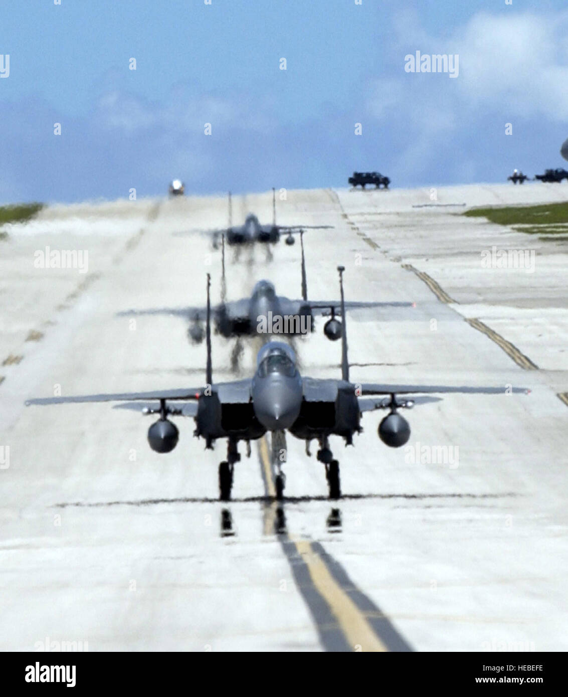 ANDERSEN AIR FORCE BASE, Guam -- F-15E Strike Eagles from the 90th Expeditionary Fighter Squadron taxi to their parking spots on Andersen Air Force Base, Guam. Deployed from Elmendorf Air Force Base, Alaska, the 90th EFS is participating in exercise Valiant Shield 2006. Valiant Shield begins June 19 and lasts through June 23, and will be conducted in the vicinity of Guam. Valiant Shield focuses on integrated joint training among US military forces. (U.S. Air Force photo by Airman 1st Class Michael Dorus) Stock Photo