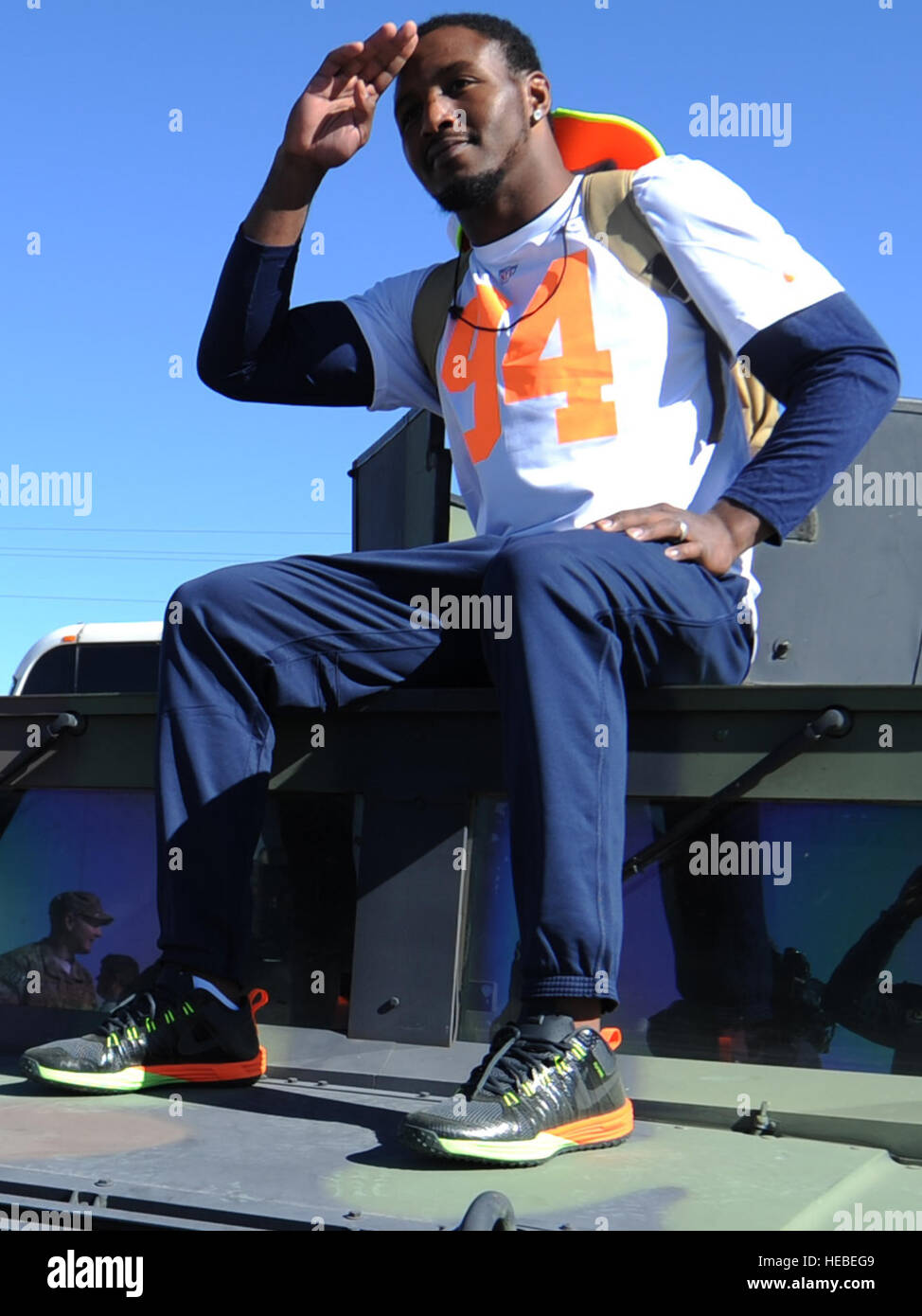 Robert Quinn, St. Louis Rams defensive end assigned to Pro Bowl Team Irvin, poses on top of a Humvee after the Pro Bowl practice at Luke Air Force Base, Ariz., Jan. 22, 2015. Quinn and other Pro Bowl players mingled with Airmen and signed autographs after conducting a practice. (U.S. Air Force photo by Staff Sgt. Staci Miller) Stock Photo