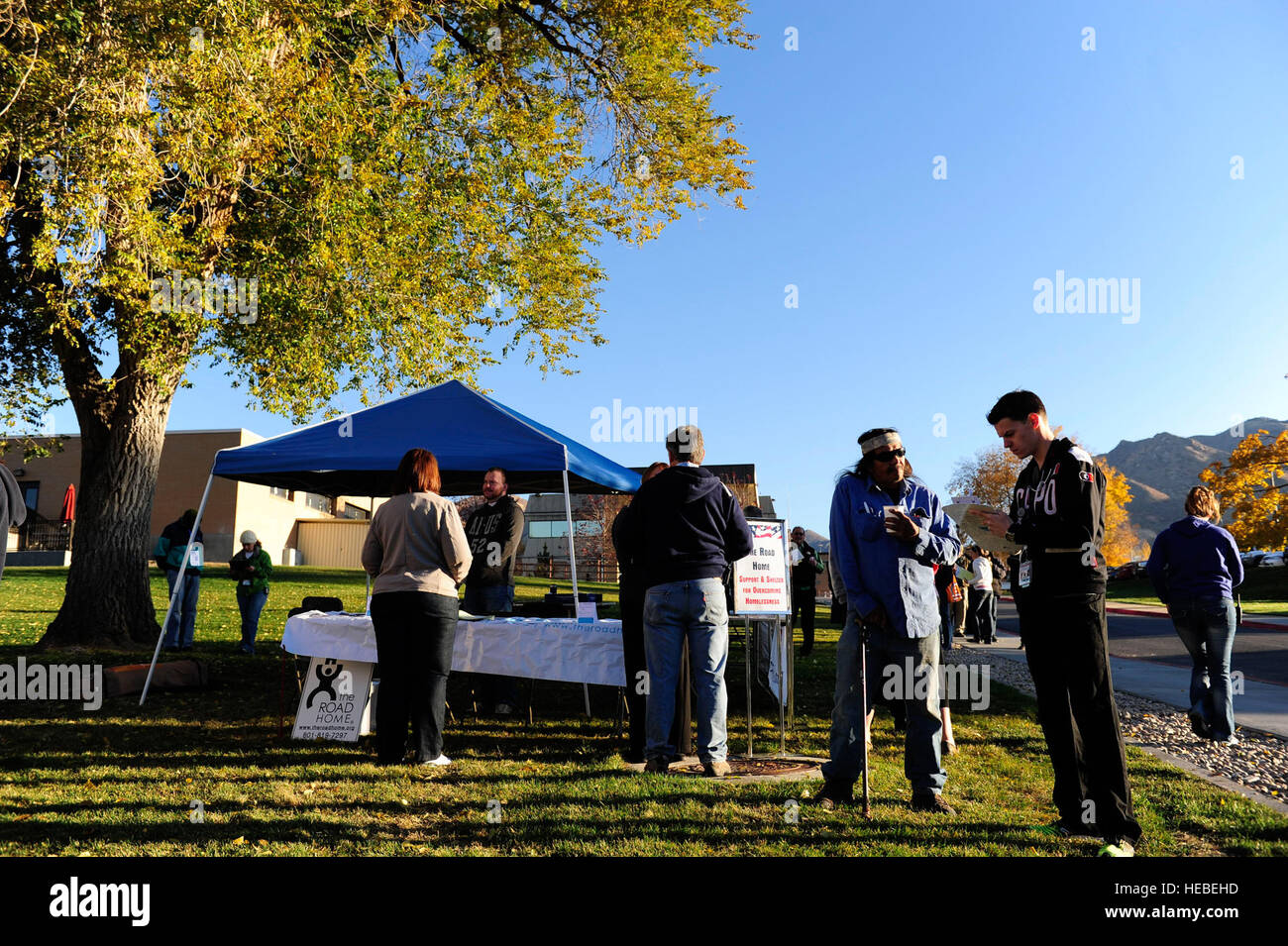 Rick LaRue (left), a U.S. Army veteran, checks in with Trevor Harris (right), a registered nurse at the George E. Wahlen Department of Veterans Affairs Medical Center during the annual Stand Down event, Salt Lake City, Utah, Nov. 2, 2012. Stand Downs are one part of the Department of Veterans Affairs’ efforts to provide services to homeless veterans. Stand Downs are typically one- to three-day events providing services to homeless veterans such as food, shelter, clothing, health screenings, VA and Social Security benefits counseling, and referrals to a variety of other necessary services, such Stock Photo